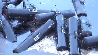 Oil leaking into flooded river after 31 tanker cars derail in Iowa