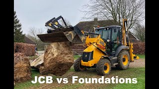 JCB 3CX pulling out concrete foundations