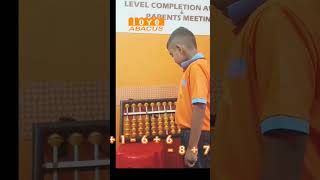7 year old child solving math problems with abacus visualisation.The Toyo Academy , Thevally ,Kollam