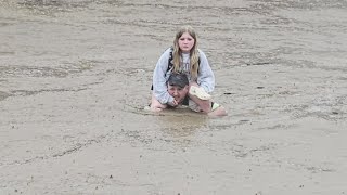 Heroic father jumps into action to save daughter from flooding school