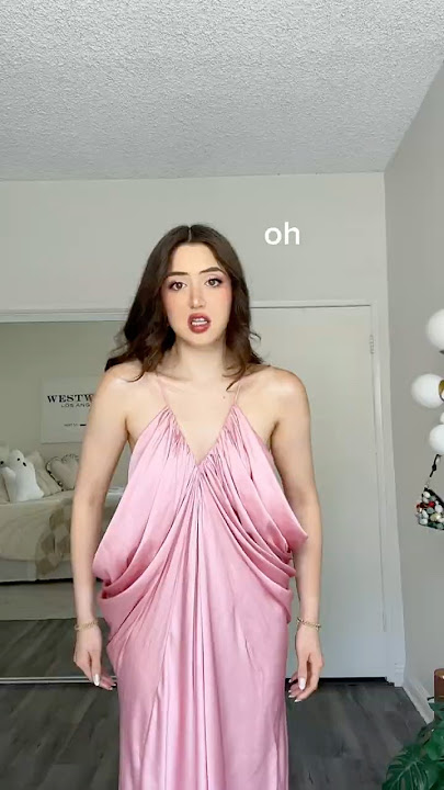 Trying on the 'IMPOSSIBLE' dress.