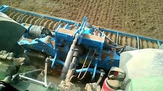 Herse rotative Lemken 5 mètres avec Fendt 933 Vario