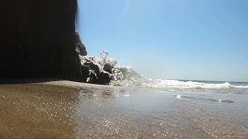 Waves from a Puddle under a Rock