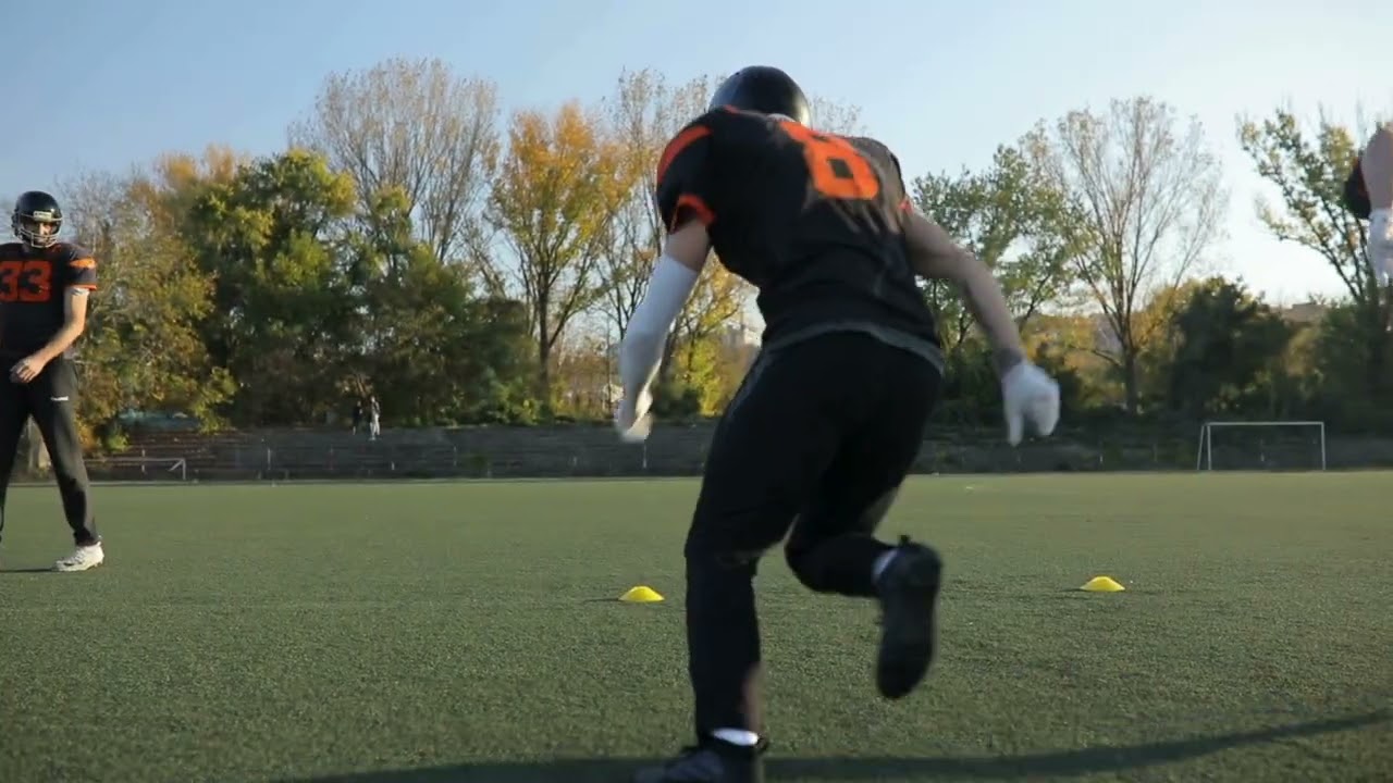 VideoVault Stock Video: American football team is training on the field