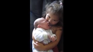 Big Sister Preciously Holds Newborn Baby Brother