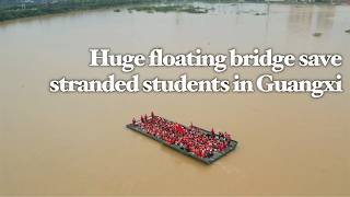 Students cheer as China's 60-meter floating bridge rescues thousands from flooded campus in Guangxi