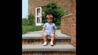 Me, aged almost 3, trying to sing Morningtown Ride