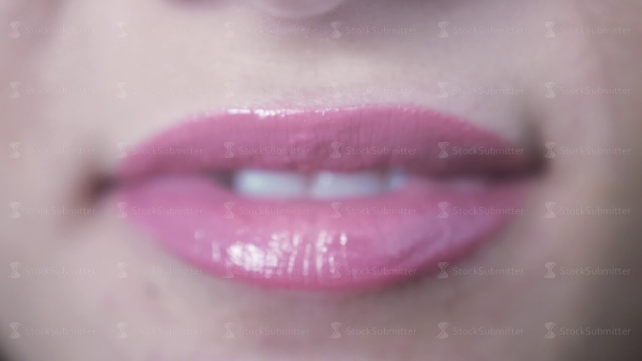 Close up of beautiful smiling sensual pink lips of young girl with open ...