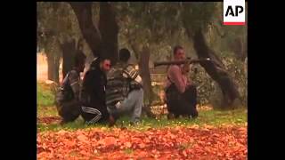 Footage captured by an AP video journalist shows rebel fighters in Syria bracing for an advance by g