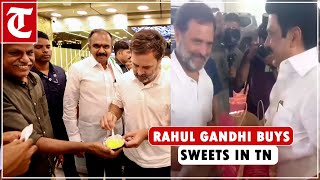 Congress MP Rahul Gandhi buys sweets from a shop in Coimbatore, Tamil Nadu