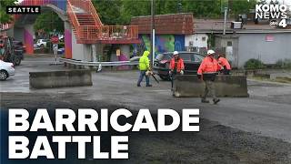 SDOT removes street barricades near Aurora Ave; neighbors doubtful of temporary measures