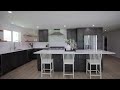 Black kitchen with white countertops