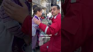 Palestine Red Crescent staff member tries to calm terrified child