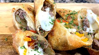 COOKING WITH MEECH AND MONICA | PHILLY CHEESESTEAK EGG ROLLS | PHILLY CHEESESTEAK BAKE