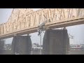 Semi truck hangs off clark memorial bridge in louisville driver rescued