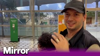 Oti Mabuses husband Marius arrives in Australia with their daughter