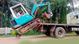 Loading a Komatsu 30 Excavator onto a Truck | Heavy Equipment Transport Guide