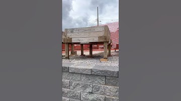 Engineered retaining wall with Versa Lok block