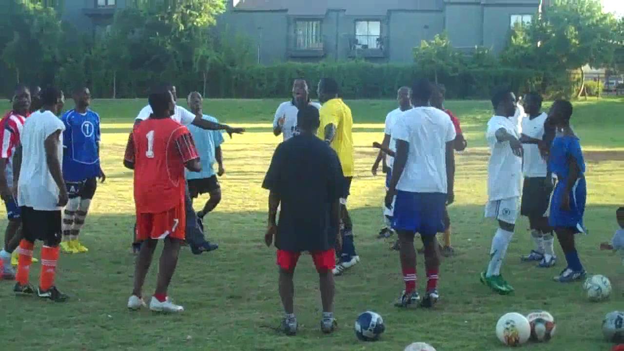 African style warmup before a neighbourhood football game - Filmed by ZIMBABWE Productions