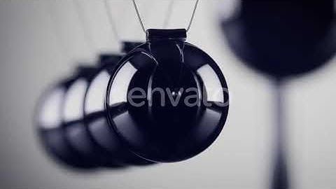 The balls of a Newtons Cradle colliding in slow motion | Stock Footage - Envato elements