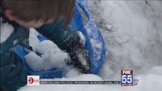 Fort Wayne kids and parents enjoy the first big snowfall of the season