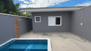 Oportunidade de casa nova em Peruíbe com 03 suítes e piscina em rua pavimentada (13) 99601-2286
