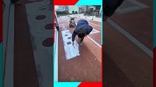 Using a stencil, spray paint machine to create a fun outdoor kids playground path #DIY #Creativity