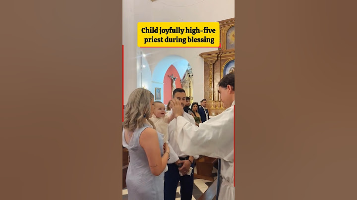 Child joyfully high-fives priest during blessing, heartwarming church moment #priest #child #newpope