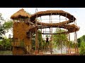 Build five  story mud house with swimming pool  and build hut around swimming pool full