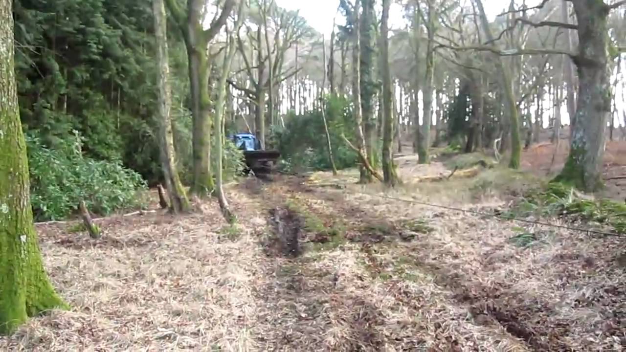 Field Marshal Tractor winches out New Holland.MOV