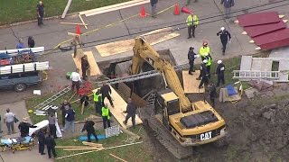 Working To Save Man Trapped In Ditch