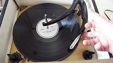 Magnavox record player playing a 33.3 RPM LP record