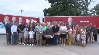 Hy-Vee honors long-time employees by putting their photos on company semi trailers