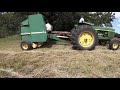 Haying Native Prairie with Deere 2840 with 24T and 330 Balers.  Watch for the Maremma!