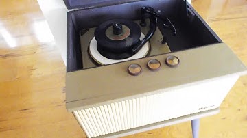 Magnavox 1957 record player playing a stack of 45
