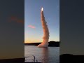 Ultra-realistic 4K raw footage of a naval warship launching a missile at sunrise, detailed deck