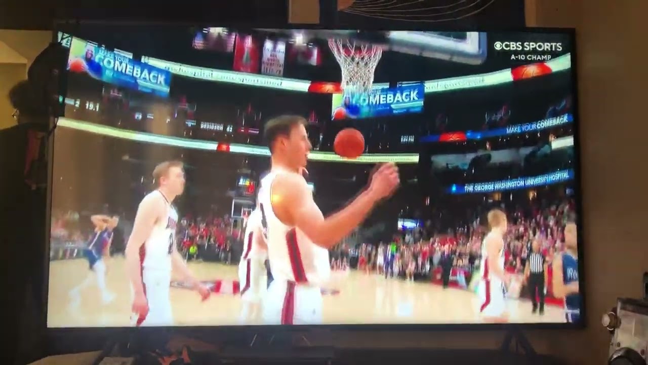 Matt Grace hits a shot at the rim and makes free throw as Richmond wins