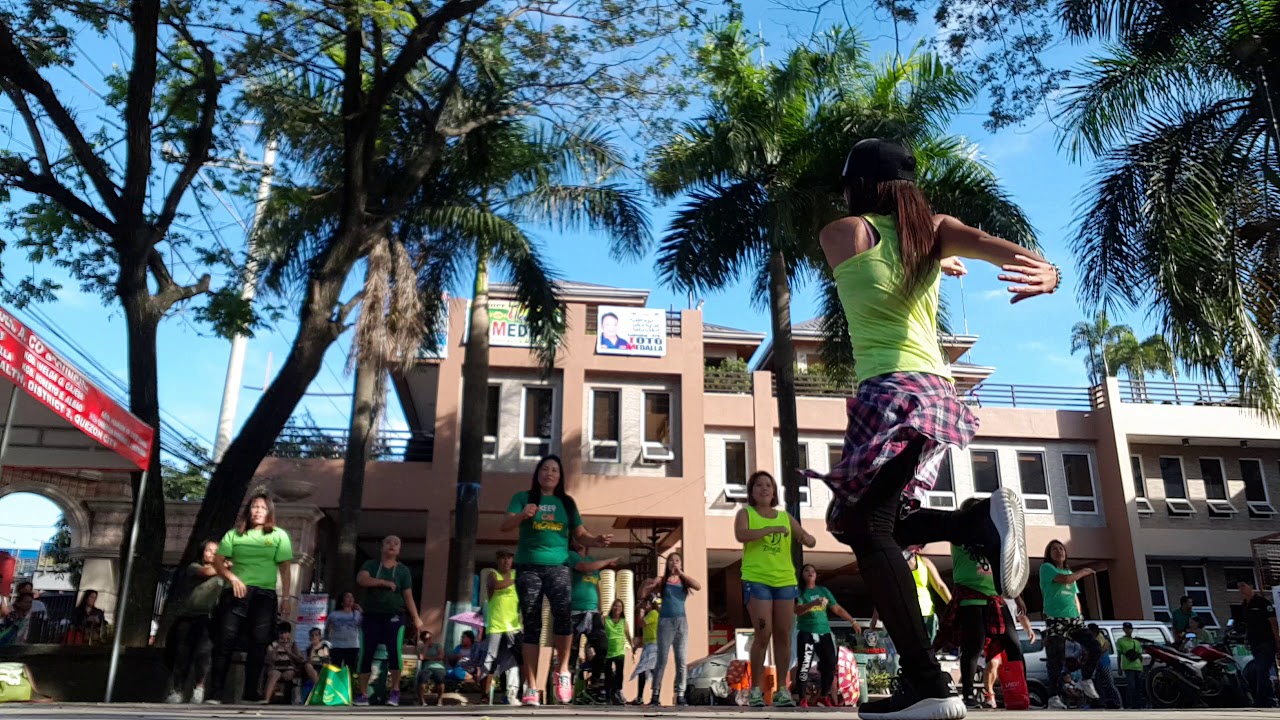 Zumbaranggay in green 3 dancing in the street