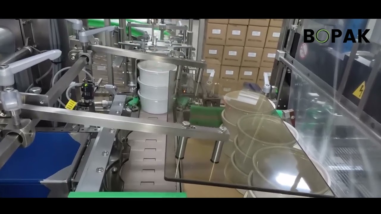Fardelage avec insertion plaque carton sous les produits. Autopack by Bopak