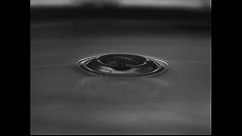 Droplet impact using a thin surfactant film