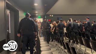 Protesters removed by officers after disrupting board of regents meeting at UC Merced