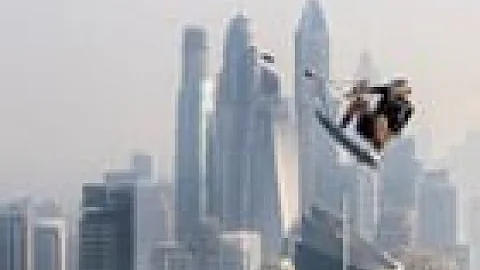 JUMPING OFF 77 STORY SKYSCRAPER Towed by a Drone Brian Grubb WakeBASE Jump off a Dubai INFINITY POOL