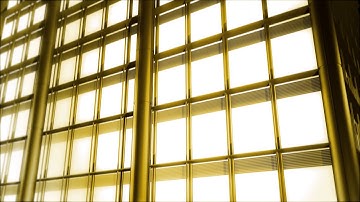 Free Video Background Loop: Camera Flying Up Over Building