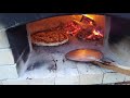 Homemade pizza from a wood-burning oven. Vermiculite pizza oven. Subscribe to see more pizza videos.