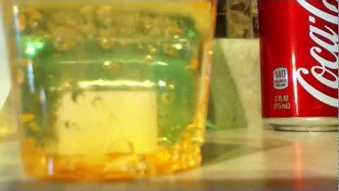 Sugar cube dissolving in perrier