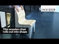 This wooden chair rolls out into shape This wooden chair rolls out into shape