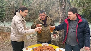 Shrimps fried in a cauldron with fresh beer in nature. Recipe