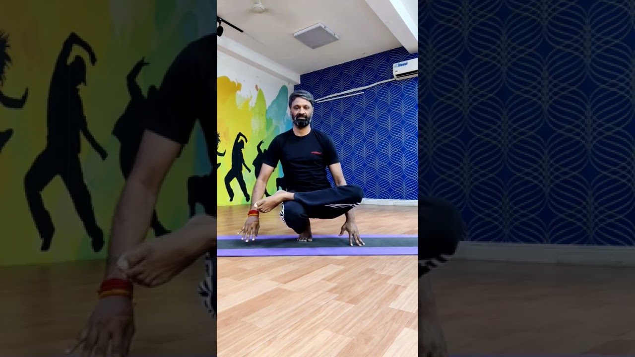 Ekpada Utkatasana  Half Lotus Toe Balancing Pose 