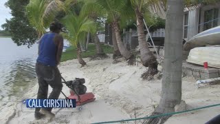 Homeowners complain of erosion after neighbor turns backyard into beach