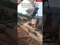 Lift the concrete mixing tank with an excavator bucket and move it to the designated position